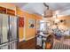 Open kitchen features island, stainless steel appliances, and view to dining area at 304 W 6Th St, Mesa, AZ 85201