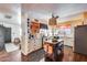 Bright kitchen featuring white cabinets, an island, and modern appliances at 304 W 6Th St, Mesa, AZ 85201