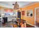 Bright kitchen featuring white cabinets, an island, stainless appliances and orange accents at 304 W 6Th St, Mesa, AZ 85201
