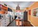 Bright and unique kitchen with white cabinetry, tile counters and a vintage-style island at 304 W 6Th St, Mesa, AZ 85201