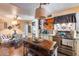 Spacious open kitchen with island, tile countertops, and adjacent dining area at 304 W 6Th St, Mesa, AZ 85201