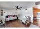 Comfortable living room featuring a daybed, ceiling fan, and access to an outdoor space at 304 W 6Th St, Mesa, AZ 85201