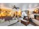 Cozy living room features a painted fireplace, stylish furnishings and lots of natural light at 304 W 6Th St, Mesa, AZ 85201