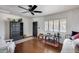 Bright living room featuring hardwood floors, ample seating, and a ceiling fan at 304 W 6Th St, Mesa, AZ 85201