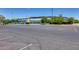 View of a parking lot near the stadium with green trees on a clear day at 304 W 6Th St, Mesa, AZ 85201