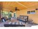 Covered patio with outdoor furniture, ceiling fans, and access to the backyard at 304 W 6Th St, Mesa, AZ 85201