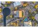Aerial shot of a home's roof, driveway, and landscaping showcasing the backyard turf and privacy fence at 32806 N 55Th Pl, Cave Creek, AZ 85331