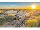 Desert home featuring beautiful landscaping and mountain views at sunset at 32806 N 55Th Pl, Cave Creek, AZ 85331