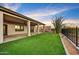 Spacious backyard with artificial turf, gravel and covered patio, a relaxing desert oasis at 32806 N 55Th Pl, Cave Creek, AZ 85331