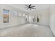 Spacious bedroom with carpet floors, windows providing plenty of natural light, and french doors at 32806 N 55Th Pl, Cave Creek, AZ 85331