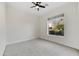 Light-filled bedroom with a ceiling fan and a scenic window view at 32806 N 55Th Pl, Cave Creek, AZ 85331