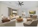 Bright living room with modern furniture, light wood floors and neutral tones offers a serene atmosphere at 32806 N 55Th Pl, Cave Creek, AZ 85331