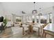 Open-concept living space blends a dining area with a relaxed seating area, perfect for modern living at 32806 N 55Th Pl, Cave Creek, AZ 85331