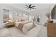 Serene main bedroom with soft lighting, a plush bed, and access to a private outdoor patio at 32806 N 55Th Pl, Cave Creek, AZ 85331
