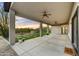 Covered patio featuring ample seating, ceiling fans, and a desert view at 32806 N 55Th Pl, Cave Creek, AZ 85331