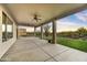 Covered patio with ample seating space, ceiling fans, and desert landscaping at 32806 N 55Th Pl, Cave Creek, AZ 85331