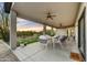 Spacious covered patio features outdoor dining and lounge area perfect for enjoying sunsets and outdoor living at 32806 N 55Th Pl, Cave Creek, AZ 85331