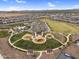 Aerial view of neighborhood park featuring playground, splashpad, ramadas, and lawn at 3309 E Malibu Dr, San Tan Valley, AZ 85143