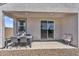 Cozy covered patio with outdoor seating and desert landscaping, perfect for relaxing at 3309 E Malibu Dr, San Tan Valley, AZ 85143