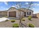 Charming single-story home featuring a two-car garage and low maintenance desert landscaping at 3309 E Malibu Dr, San Tan Valley, AZ 85143