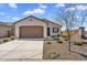 Charming single-story home featuring a two-car garage and low maintenance desert landscaping at 3309 E Malibu Dr, San Tan Valley, AZ 85143