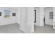 Bright hallway with tile floors, white doors, and contemporary artwork at 3309 E Malibu Dr, San Tan Valley, AZ 85143