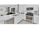 Modern kitchen with white cabinets, stainless steel appliances, and an open layout at 3309 E Malibu Dr, San Tan Valley, AZ 85143