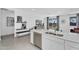 Modern kitchen with an island, stainless steel appliances, and bright white cabinets and counters at 3309 E Malibu Dr, San Tan Valley, AZ 85143