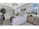 Cozy main bedroom featuring a large bed, bright windows, and stylish decor at 3309 E Malibu Dr, San Tan Valley, AZ 85143
