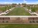 Well-manicured park with grassy lawn, trees, benches, and a decorative sign at 3309 E Malibu Dr, San Tan Valley, AZ 85143