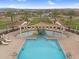 Aerial view of community pool and splash pad with lounge seating and shade at 3309 E Malibu Dr, San Tan Valley, AZ 85143