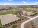 Community aerial view of the sand volleyball court, basketball court, and picnic area at 3347 E Malibu Dr, San Tan Valley, AZ 85143
