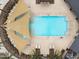 Aerial view of pool with sunshades, lounge seating and splash pad in the community at 3347 E Malibu Dr, San Tan Valley, AZ 85143