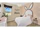 A playful bedroom features a unique bunny-themed decor, soft lighting, and plush bedding creating a whimsical space at 3347 E Malibu Dr, San Tan Valley, AZ 85143