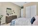 This is a peaceful bedroom features neutral decor, soft bedding, and access to a closet, providing a relaxing retreat at 3347 E Malibu Dr, San Tan Valley, AZ 85143