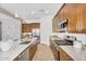 Well-lit kitchen with quartz countertops, modern appliances, and ample cabinet space for storage at 3347 E Malibu Dr, San Tan Valley, AZ 85143