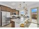 Modern kitchen featuring stainless steel appliances, a large island with seating, and pendant lighting at 3347 E Malibu Dr, San Tan Valley, AZ 85143