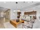 Open-concept living space with a view into a modern kitchen, stylish decor, and plenty of natural light at 3347 E Malibu Dr, San Tan Valley, AZ 85143