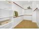 Bright and spacious walk-in closet featuring white shelving and ample storage space at 3347 E Malibu Dr, San Tan Valley, AZ 85143