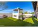 Backyard featuring artificial grass, a built-in grill, and outdoor furniture around the pool at 3522 E Penedes Dr, Gilbert, AZ 85298