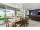 Dining area with an outdoor view and a large wood table with seating at 3522 E Penedes Dr, Gilbert, AZ 85298