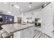 Bright kitchen features a large island with a granite countertop and modern stainless steel appliances at 3522 E Penedes Dr, Gilbert, AZ 85298