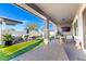 Outdoor patio featuring sleek tile flooring, comfortable seating and a view of the pool and backyard at 3522 E Penedes Dr, Gilbert, AZ 85298