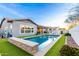 Gorgeous backyard pool and lush landscaping, creating a serene and inviting outdoor space at 3522 E Penedes Dr, Gilbert, AZ 85298