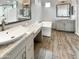 Elegant bathroom with dual sinks, granite counters, soaking tub, and modern fixtures at 4171 E Ronald St, Gilbert, AZ 85295