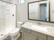 Well-lit bathroom featuring a walk-in shower, grey vanity, and tile flooring at 4171 E Ronald St, Gilbert, AZ 85295