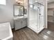Bathroom featuring glass-enclosed shower, granite counters and modern fixtures at 4171 E Ronald St, Gilbert, AZ 85295