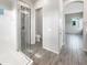 Open-concept bathroom with glass shower and tile flooring throughout at 4171 E Ronald St, Gilbert, AZ 85295