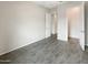 Bedroom featuring wood-look tile flooring, neutral paint, and closet at 4171 E Ronald St, Gilbert, AZ 85295