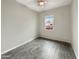 Bright bedroom featuring wood-look tile flooring and a ceiling fan at 4171 E Ronald St, Gilbert, AZ 85295